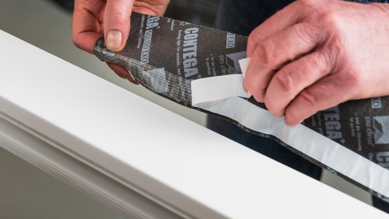 2. Start applying tape at the top of the frame